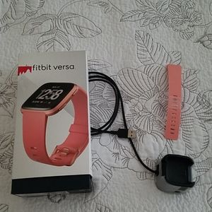 Original Fitbit Versa charger and Peach la…